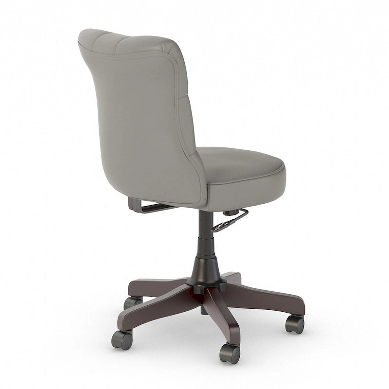 Chaise de bureau sans accoudoirs à dossier mi-haut touffeté et réglable en hauteur